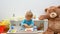 Happy cute child boy having fun playing with colorful wooden puzzle, at home. Indoor activity for kids