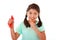 Happy cute female child licking and eating red licorice candy in kid love sweet and sugar concept