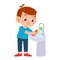 happy cute kid boy wash vegetable fruit clean