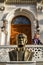 Happy Cute Little Girl is Smiling Behind an Ataturk Bust