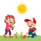 happy cute little kid boy and girl plant flower