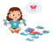 happy cute little kid girl play jigsaw puzzle