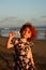 Happy Cute little redhead girl on the Bali beach. Sunset