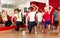 Happy dancers exercising in gym