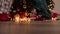 happy dancing legs Christmas socks and pajamas near Christmas tree golden lights
