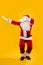 Happy dancing Santa Claus squating and waving hands