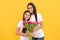 Happy daughter girl and mother hold bouquet of spring tulip flowers for 8 march holiday, womens day