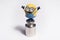 Happy despicable minion toy staying on the little scales weight