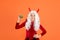 Happy devil kid with white hair hold pumpkin vegetable wear horns costume of imp on halloween party, halloween