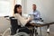 Happy Disabled Businesswoman Working On Laptop