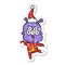 happy distressed sticker cartoon of a alien dancing wearing santa hat