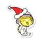 happy distressed sticker cartoon of a astronaut wearing santa hat