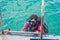 Happy diver returns to the ship after diving