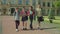 Happy diverse multiracial college students walking after lecture at campus