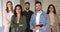 Happy diverse professional business teammates posing in office