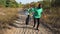 Happy diverse volunteers dancing collecting trash