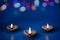 Happy Diwali - Clay Diya lamps lit during Dipavali