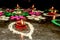 Happy Diwali. Diya Oil Lamps of DIPAWALI celebration decorated over Handmade Rangoli