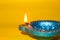 Happy diwali or happy deepavali greeting card made using a photograph of diya or oil lamp