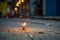 Happy Diwali - Lit diya lamp on street with firecrackers, neural network generated photorealistic image