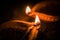 Happy Diwali - Terracotta diya or oil lamps over clay