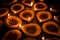 Happy Diwali - Terracotta diya or oil lamps over clay surface or ground, selective focus