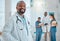 Happy, doctor and portrait of black man in hospital for medical help, insurance and trust. Healthcare, clinic team and