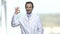 Happy doctor or scientist showing ok sign.