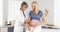 Happy doctor touching pregnant woman\'s belly