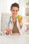 Happy doctor woman giving apple instead of donut