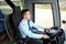 Happy driver driving intercity bus