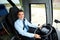 Happy driver driving intercity bus