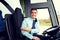 Happy driver inviting on board of intercity bus