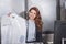 happy dry cleaning manageress holding shirt on hanger packed