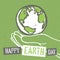 Happy Earth Day. Design for Earth Day. Concept Poster With Earth in hands. On recycled paper texture. Template for Celebrating