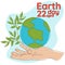 Happy Earth Day. Light male hands hold the globe, the earth, a growing branch. The concept of Earth Day. A modern