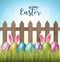 Happy Easter background with realistic 3d colorful eggs, wooden fence, flowers and hiding bunny ears.