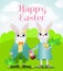 Happy Easter bunnies stand on a green field. Rabbits are smiling and holding a basket of decorative eggs.