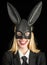 Happy easter. Bunny ears concept. Sexy woman wearing a black Easter Bunny. Beautiful young woman with bunny ears and