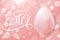 Happy Easter celebrate banner with easter egg, hand lettering text design and pink bokeh background.