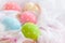 Happy easter! Colorful of Easter eggs in nest with flower, paper star and Feather on white cheesecloth and bright pink pastel