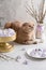 Happy Easter concept. Easter composition, greeting card, poster. Cute cat with easter egg in his paws and meringue nests with eggs