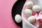 Happy Easter. Congratulatory easter. Easter eggs on a beautiful towel plate on a pink background