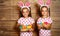 Happy easter! cute twins girls sisters dressed as rabbits with e