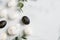 Happy Easter flat lay composition. Luxury Easter eggs, rabbit bunny, eucalyptus leaves on marble background