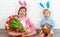 Happy easter! funny funny children with ears hare getting read