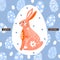 Happy Easter greeting card with creative bunny. Decorative egg background.