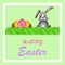 Happy Easter Greeting Postcard. Colorful Paschal Eggs In A Basket And Rabbit On Carrot Field With Easter Ornate