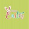 Happy Easter. Hand drawn calligraphic lettering. Isolated color text on green background. Vector illustration