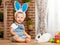 Happy easter! happy funny baby boy playing with bunny